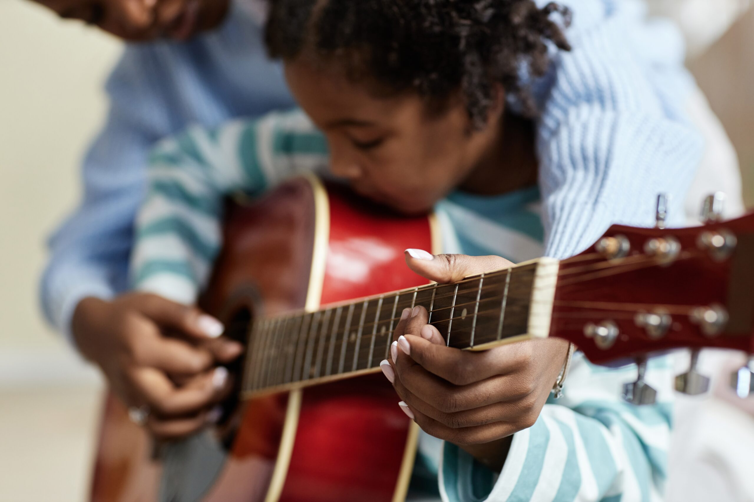 Parent daughter guitar practice